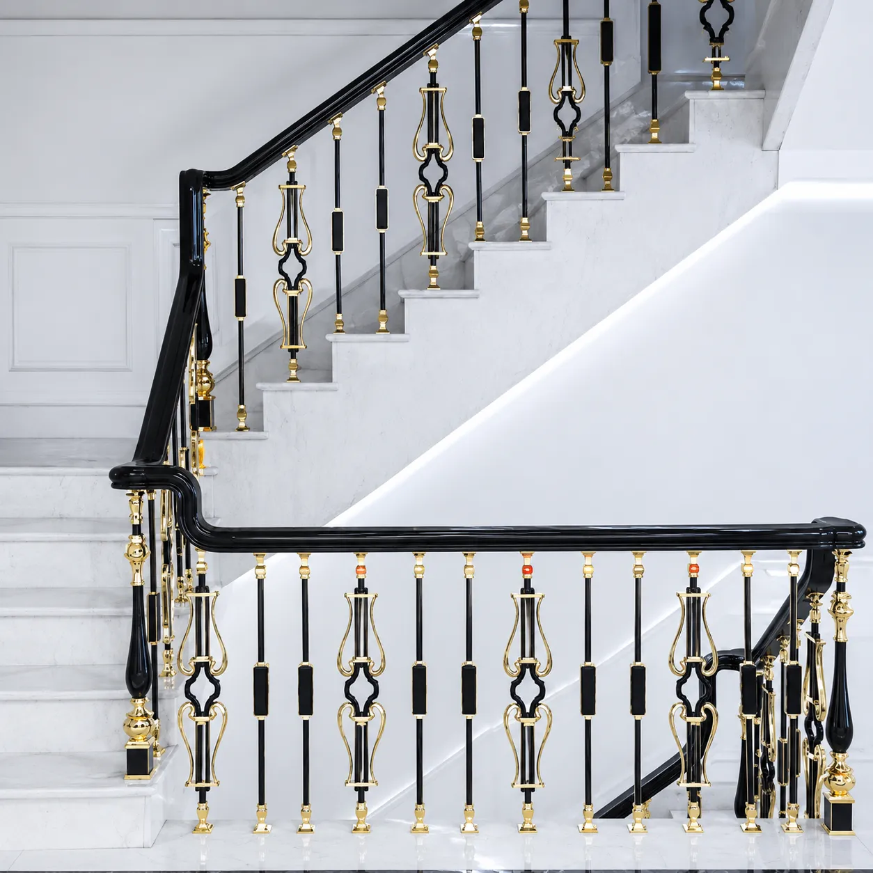 Staircase railing in a black and gold PVD finish