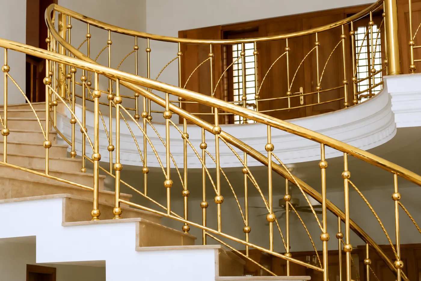 Staircase railing in a gold PVD finish
