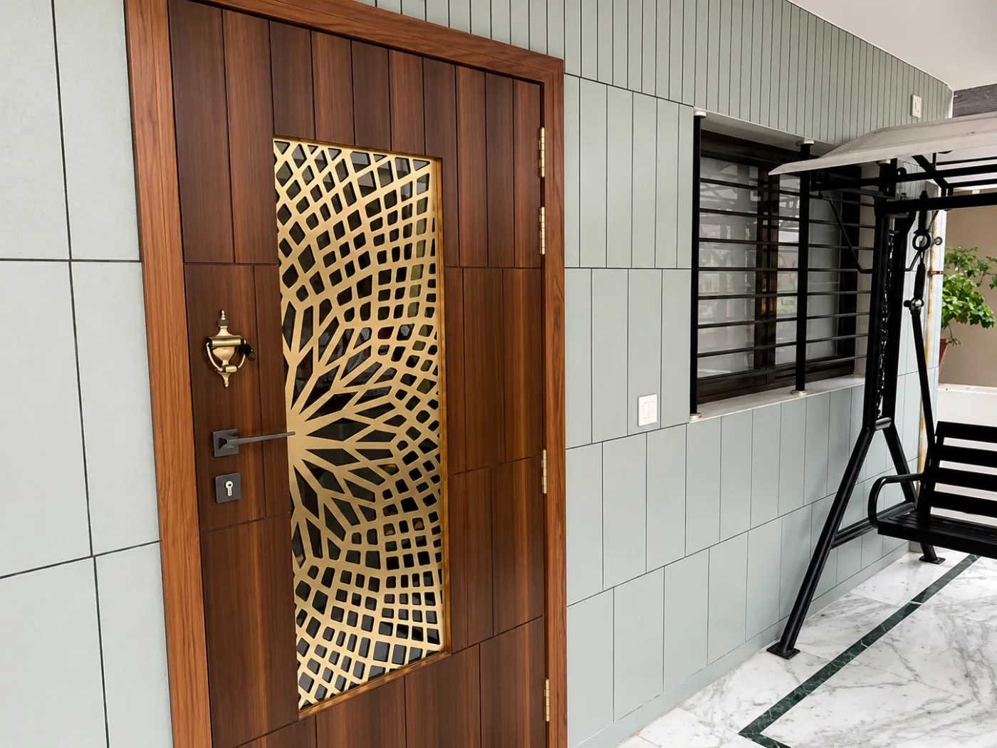 Apartment safety door with a gold PVD-coated finish
